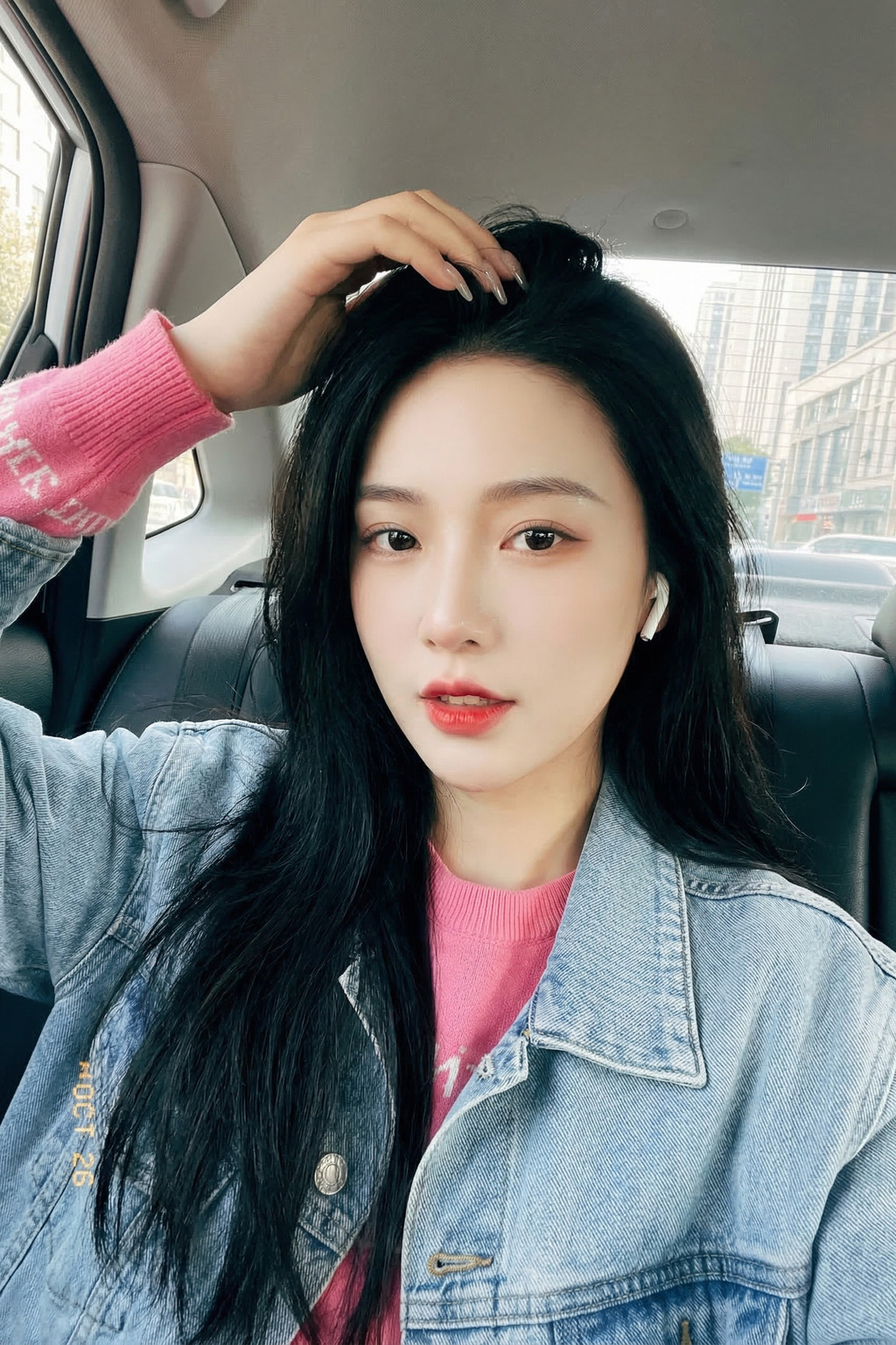 Close-Up Portrait Selfie With Hand in Hair and Denim Jacket