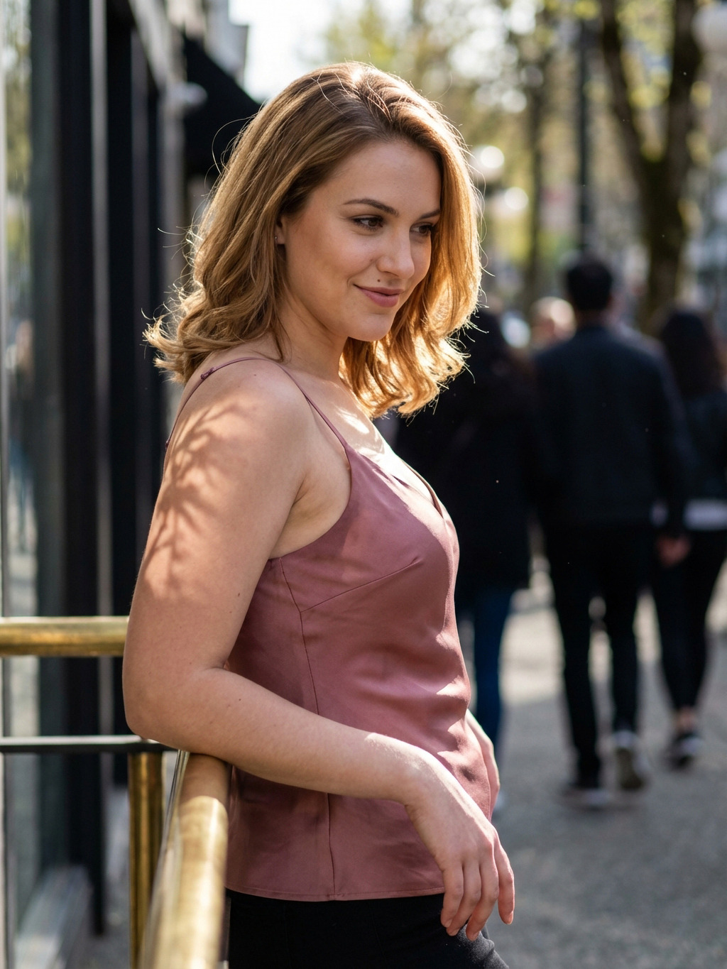 Soft side-profile smile in warm street light