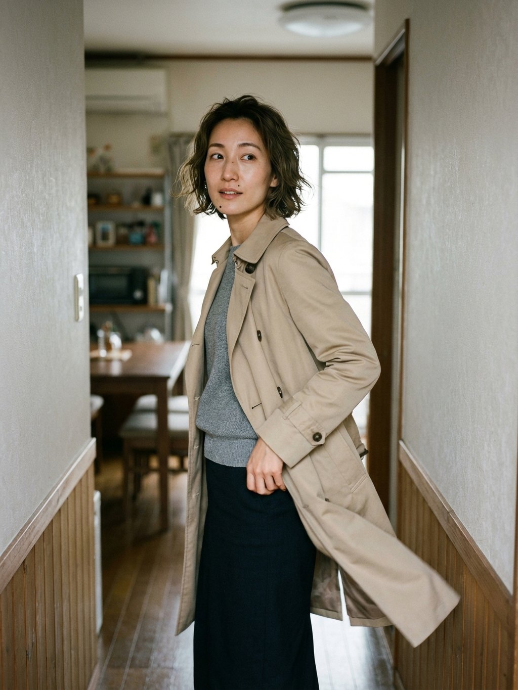 A quick turn in the hallway, coat hem still in motion